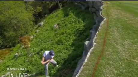 Justin Thomas plays a shot out of a bush, and still gets some spin! 