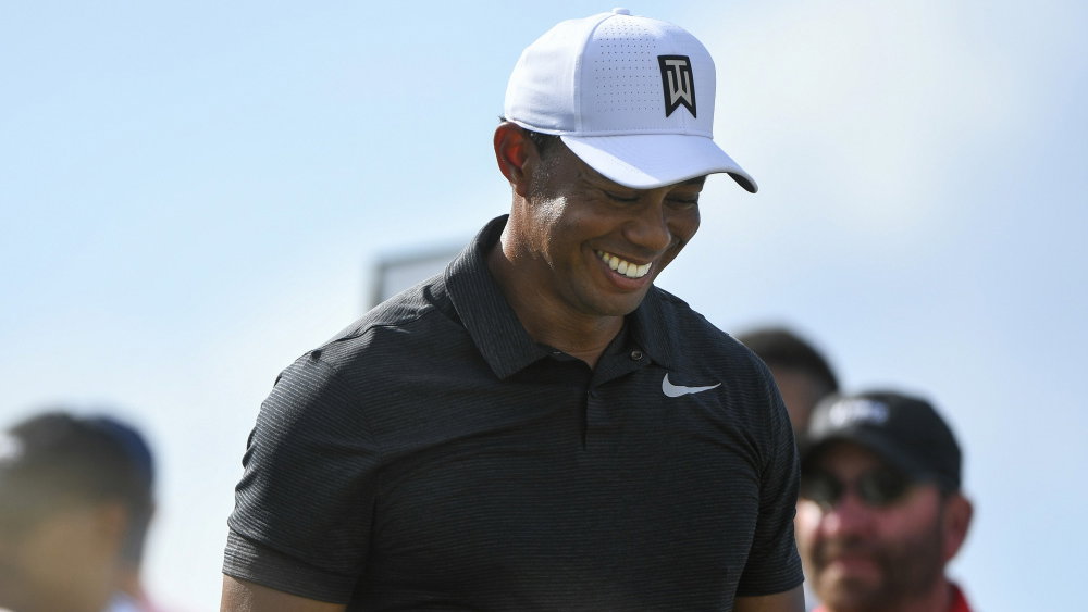 WATCH: Tiger Woods CBA to play from rough, kicks ball into fairway!