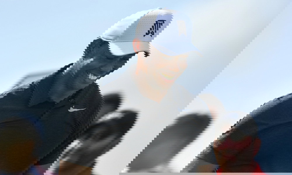 WATCH: Tiger Woods CBA to play from rough, kicks ball into fairway!