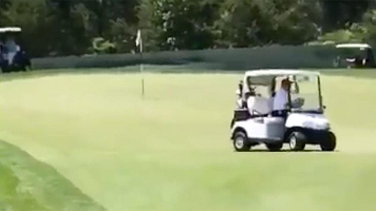 donald trump drives buggy straight across green