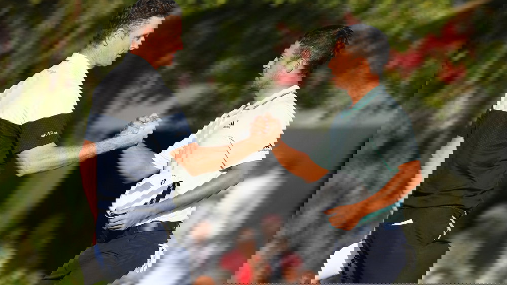 Justin Rose knocks Xander Schauffele's golf ball in the water at WGC-HSBC Champions