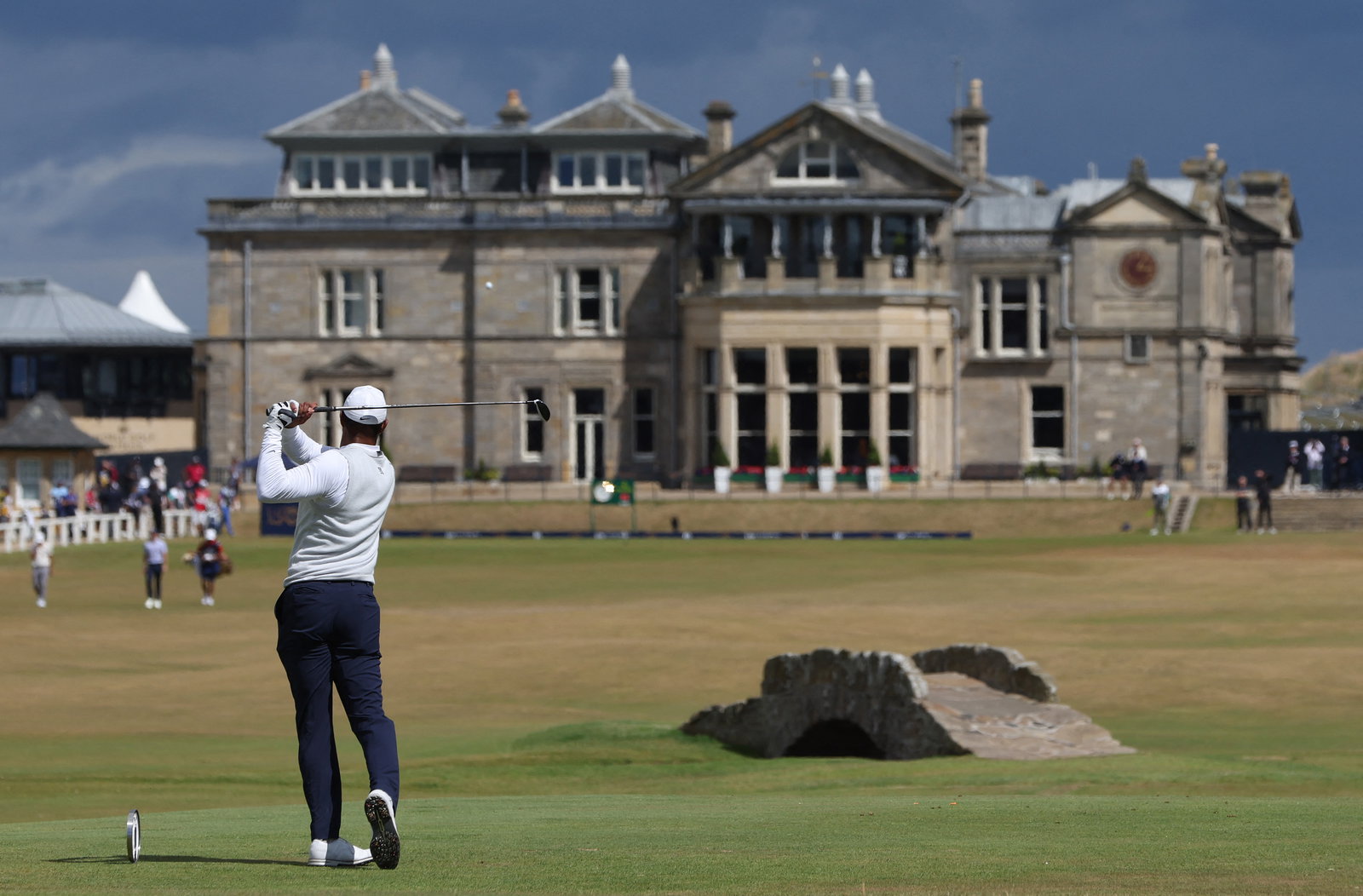 Charlie Woods looks unrecognisable as Tiger Woods returns to caddying duties