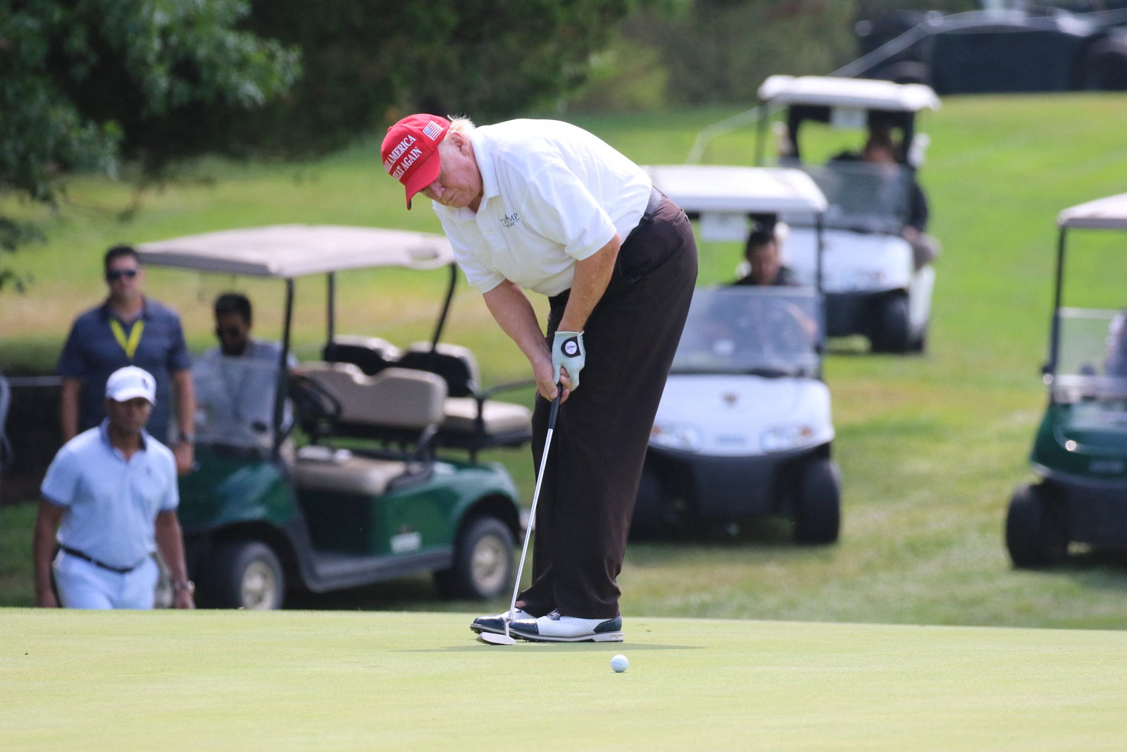 Dustin Johnson reacts after Donald Trump rocks up late to LIV Golf tee time
